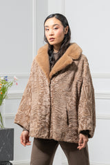 Caffe latte Swakara skin jacket featuring a wide, long-hair fur collar, cropped sleeves, and an open front closure.