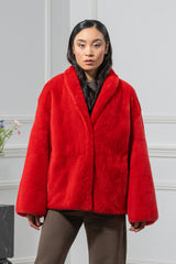 A vibrant red mink fur jacket for women with a shawl collar, wide sleeves, and a straight hem in a hip-length cut.