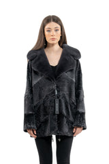 Grey Swakara jacket with long-hair fur collar, featuring diagonal fur paneling, straight sleeves, and black lining at the hem and cuffs.