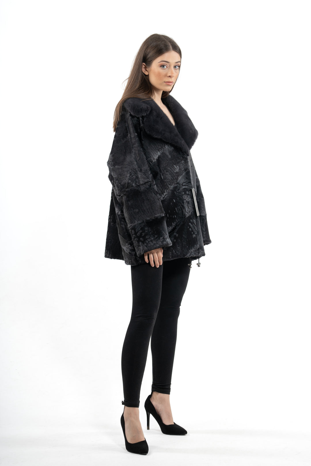 Model wearing a Grey Metal Swakara fur coat by manzari