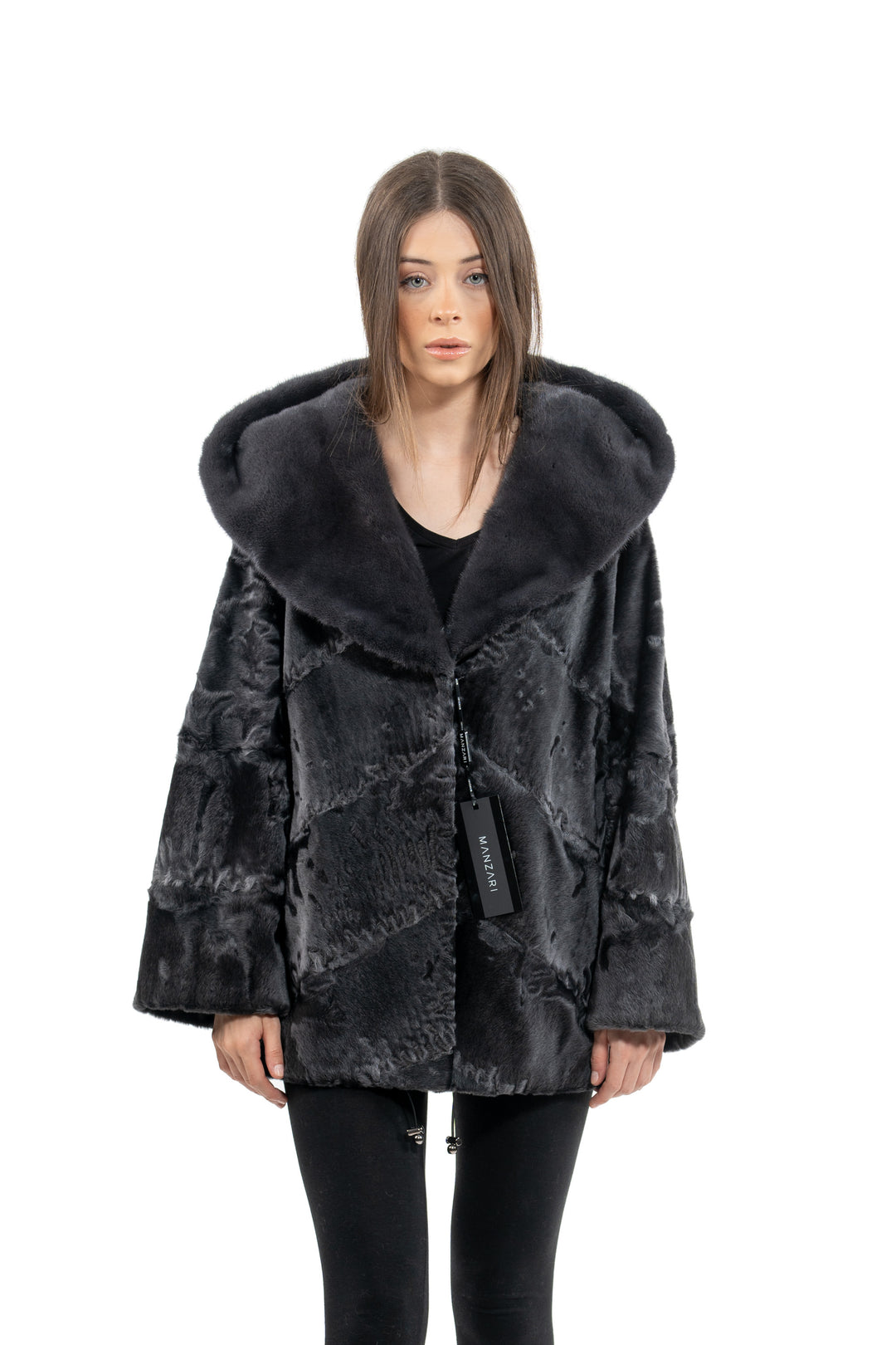 Model wearing a Grey Metal Swakara fur coat by manzari