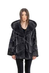 Model wearing a Grey Metal Swakara fur coat by manzari