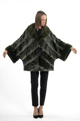 Dark olive Swakara jacket with an A-chevron pattern, featuring a wide lapel collar, long sleeves, and contrast long-hair fur cuffs.