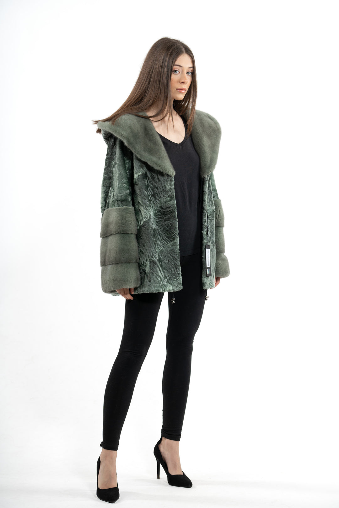 Model wearing a Green Metal Swakara fur coat by manzari
