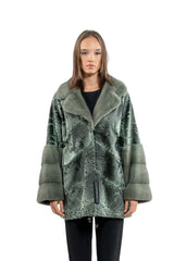 Green metallic Swakara skin short jacket with a wide collar, featuring large patch-work construction and contrasting smooth fur cuffs.