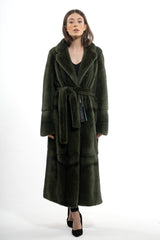 Dark olive mink fur coat with a notched collar, belted waist, and long sleeves featuring horizontal banding near the cuffs.