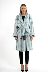 Turquoise mink fur jacket with a cross pattern, featuring a wide shawl collar, long sleeves with folded cuffs, and a matching tie-waist belt.