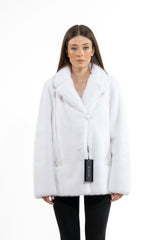 White mink fur short jacket with a wide lapel collar, front single-button closure, and side pockets with smooth leather trim, on white background.