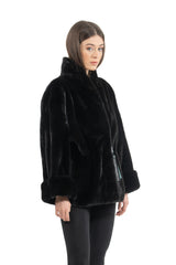Short black mink fur jacket featuring a tall standing collar and wide cuffs. Vertical fur panel construction with a smooth, velvety texture.