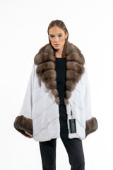 White mink fur jacket with horizontal V-chevron paneling, featuring a wide sable fur collar and matching deep sable fur cuffs.
