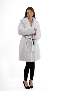 Model wearing a White Mink fur coat