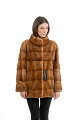 Front view of a golden mink short jacket with a high collar, featuring a grid pattern of horizontal and vertical fur panels.
