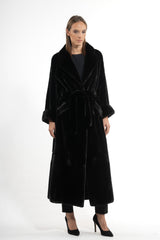 A long Blackglama mink fur coat with a wide lapel collar, belted waist, and slightly flared cuffs, shown full-length against a white background.