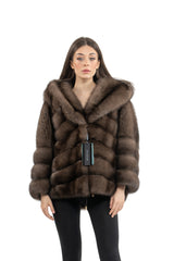 Front view of a brown Russian sable short jacket with a large hood, featuring horizontal fur panels and a drawcord hem with gold hardware.