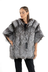 Silver natural fox fur jacket featuring a wide, open collar and three-quarter length sleeves with a voluminous, shaggy texture in grey and black.