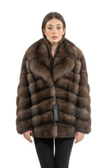 A short Russian sable jacket in rich brown, featuring horizontal fur panels, a notched collar, and a full-length front closure.