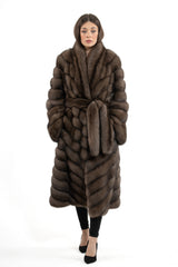 Front view of a brown Russian sable coat with a V-chevron pattern and a matching fur belt cinched at the waist, featuring a wide shawl collar.
