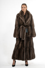 Full-length Russian sable coat in rich brown with a wide shawl collar, vertical fur pelts, and a matching tie belt.