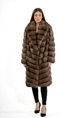 Russian sable jacket with a large shawl collar and V-chevron fur pattern. Long sleeves and knee-length straight silhouette with hidden closures.