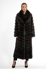 Full-length dark brown Russian sable coat featuring a wide collar and a V-chevron pattern that flows downward to the center of the garment.
