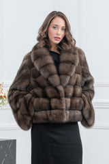 A short Russian sable fur jacket in a natural brown, featuring a wide collar and a body composed of horizontal rectangular fur panels.