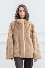 Palomino mink fur jacket with a high collar and vertical fur panels on the sleeves. The body features a clean, solid texture.