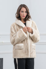 Short cinnamon mink fur jacket with a wide shawl collar, long sleeves, and two patch pockets on the front.