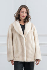 A short cinnamon mink fur jacket with a wide shawl collar, straight-cut long sleeves, and a clean, vertical pelage orientation.