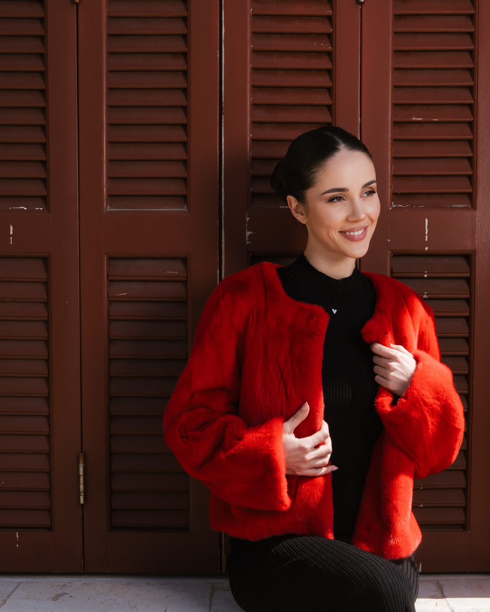 Red short womens jacket worn by model at Manzari Showroom