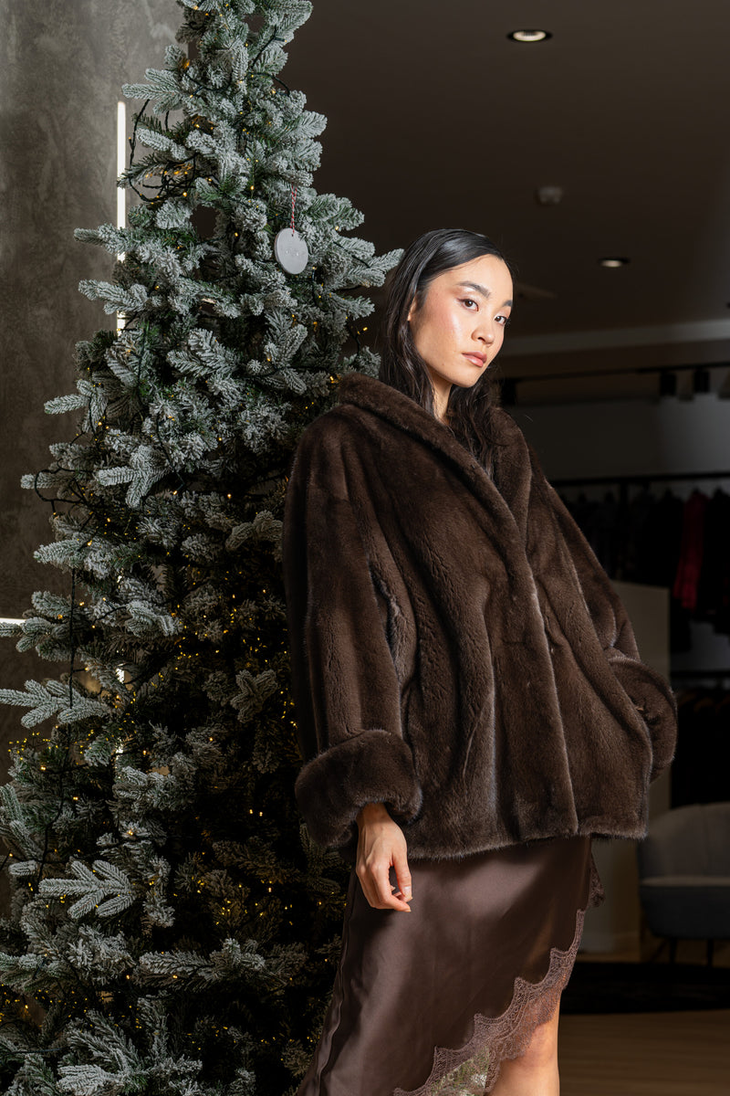 Brown Mink Coat Next to Christmas tree