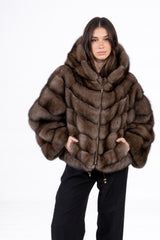Brown Russian sable jacket with a hood, featuring horizontal panels arranged in a V chevron pattern and a front zipper closure with side pockets.