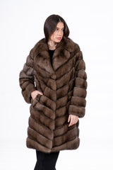 Russian sable jacket in gun metal with a V-chevron pattern, large collar, and side pockets, worn open by a model against a white background.