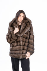 A short Russian sable jacket featuring a large hood and a brick-like pattern of horizontal and vertical fur panels.