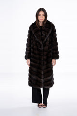 A Russian sable coat with a V chevron pattern, featuring a wide collar and long sleeves. The dark brown fur is worked in horizontal rows.