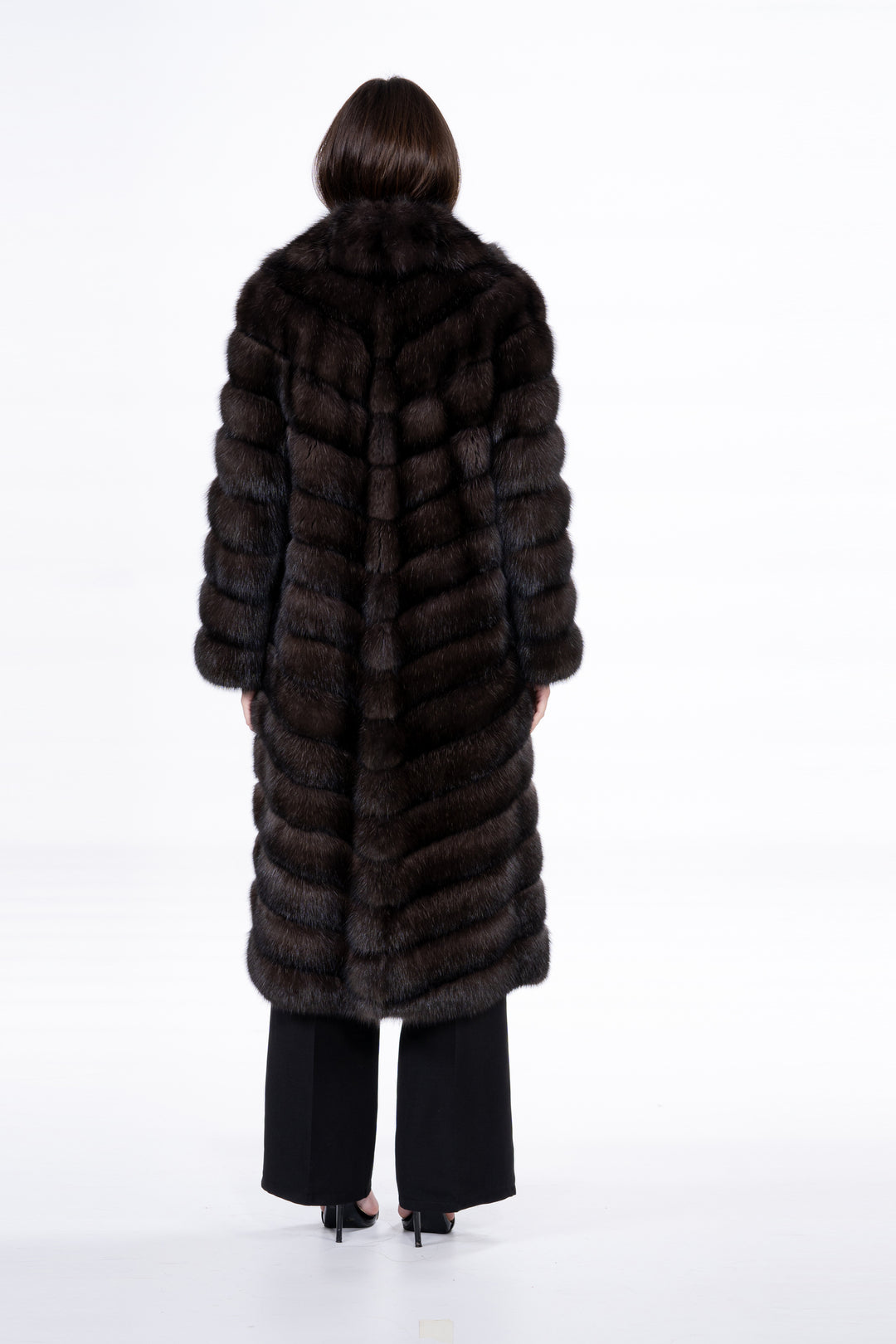 Model wearing a luxurious Russian sable fur coat by manzari