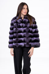 Lavender and black chinchilla skin jacket with a horizontal banded pattern, featuring a stand collar, long sleeves, and a hip-length silhouette.
