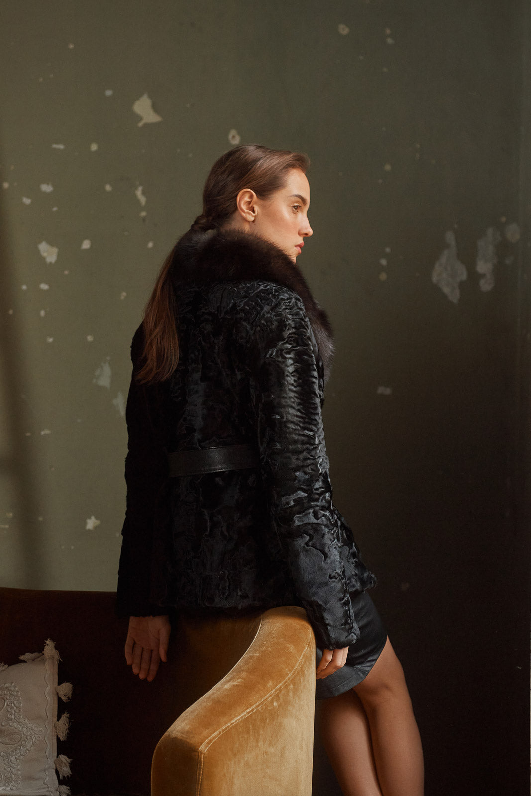 Model wearing a Black Swakara fur coat by manzari