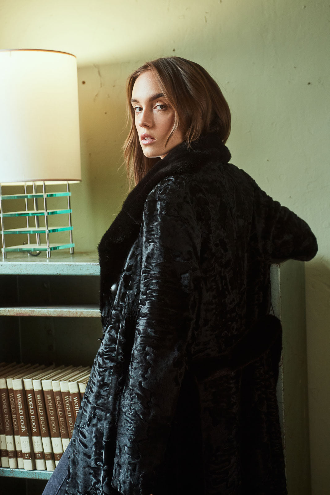 Model wearing a Black Swakara fur coat by manzari