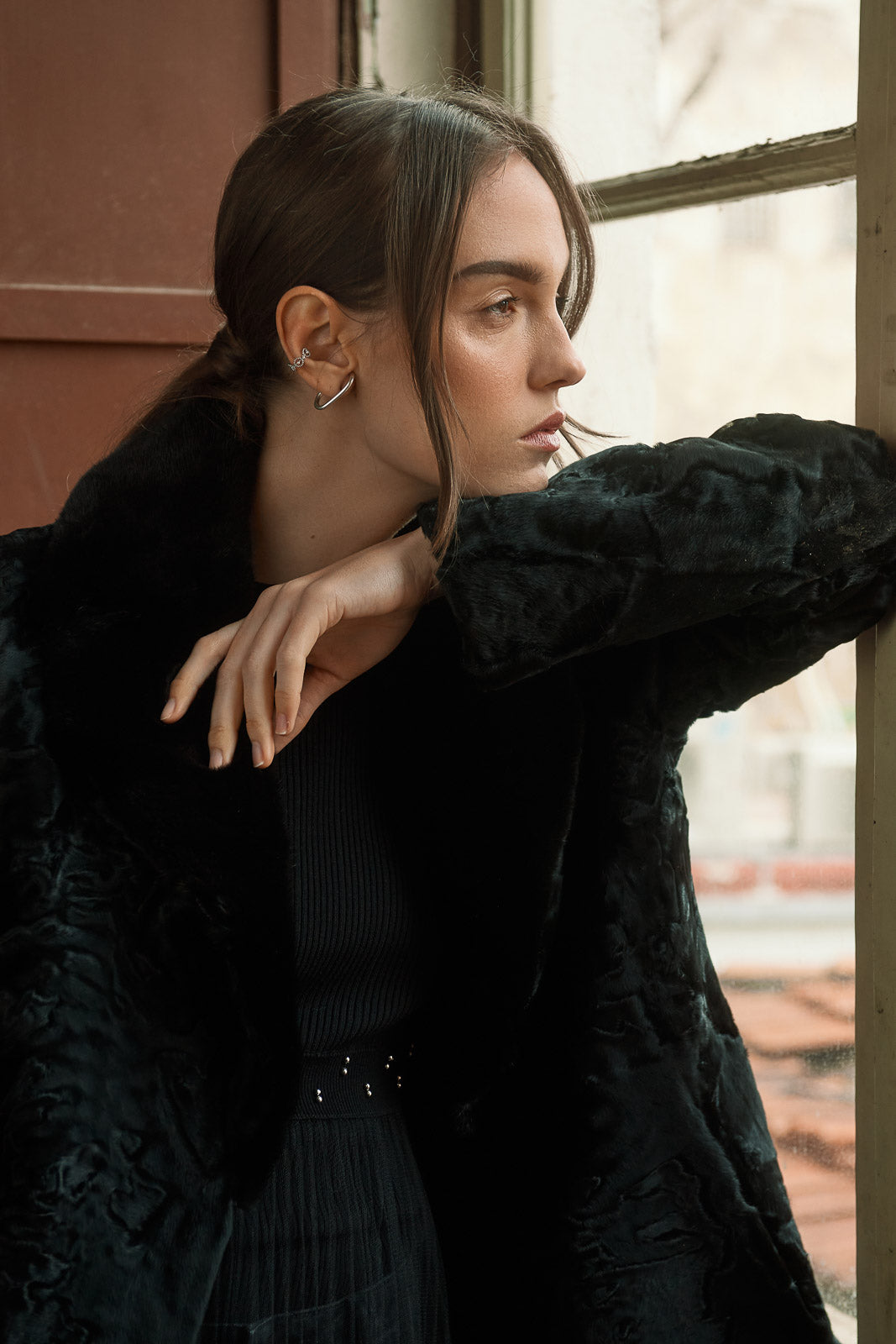 Manzari Black Swakara fur coat for a bold look