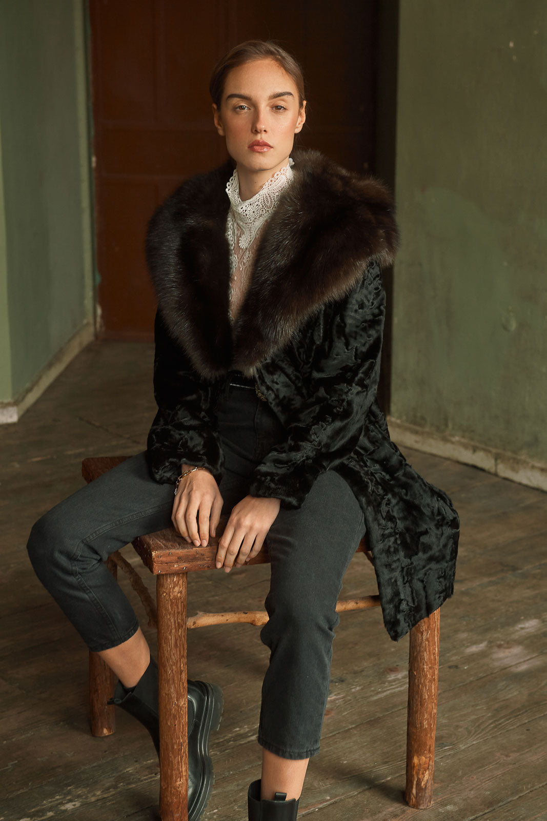 Model wearing a Black Swakara fur coat by manzari