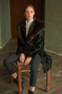 Model wearing a Black Swakara fur coat by manzari