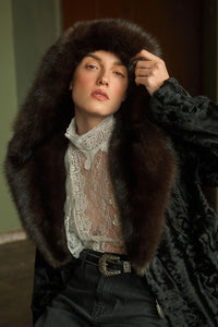 Model wearing a Black Swakara fur coat by manzari