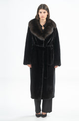 A black mink coat featuring a dark sable fur collar and a matching tie-belt, displayed in a full-length, straight-fit silhouette.