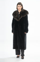 A black mink coat featuring a large sable fur hood trim, long sleeves, and a straight cut reaching below the knees.