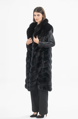 A black Russian sable coat with a sleeveless, long silhouette, featuring a plush collar and a downward-pointing V-chevron fur pattern throughout.